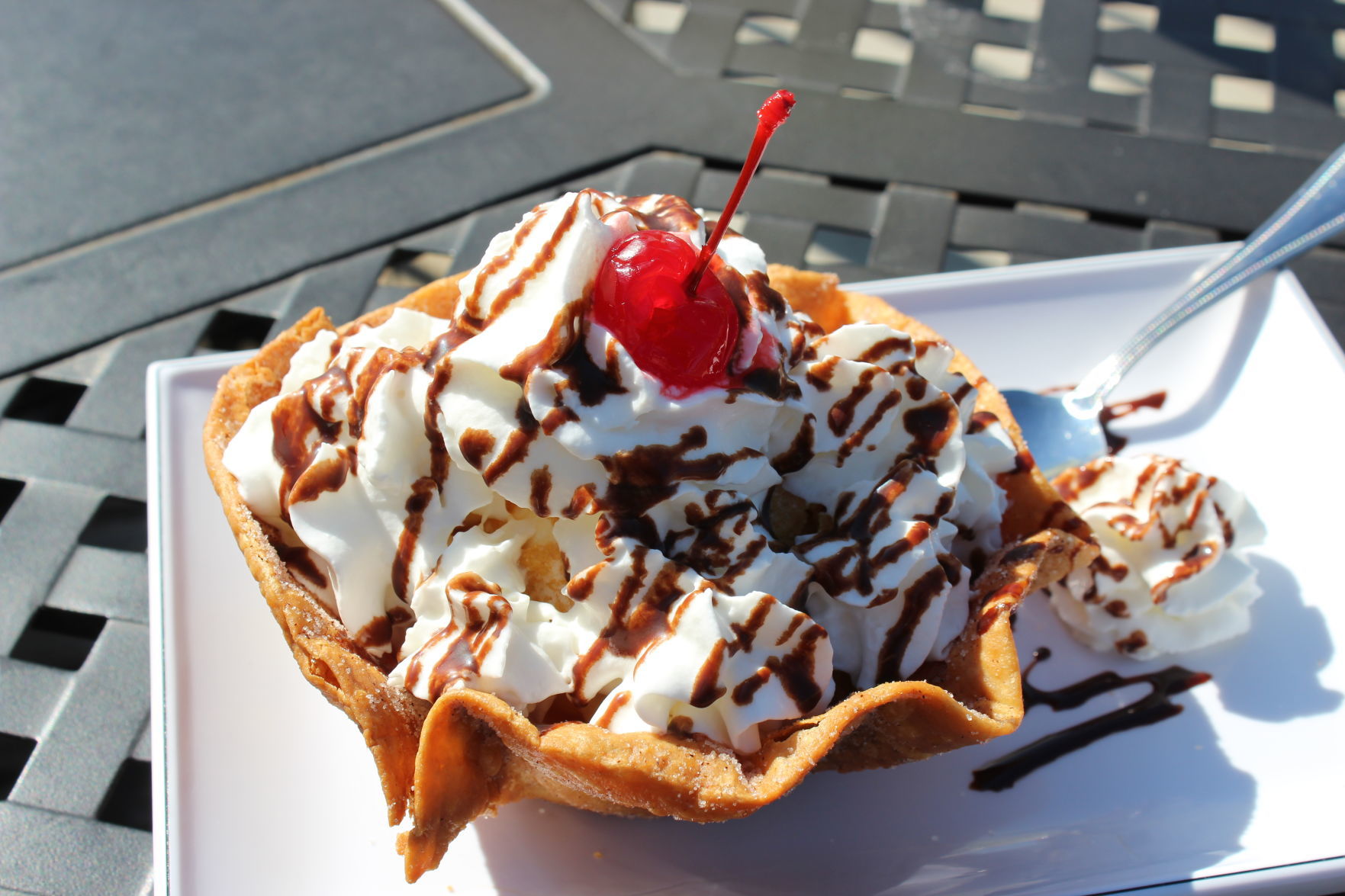 Fried vanilla ice cream with whipped cream and chocolate sauce served in a fried tortilla covered in sugar and cinnamon. .JPG